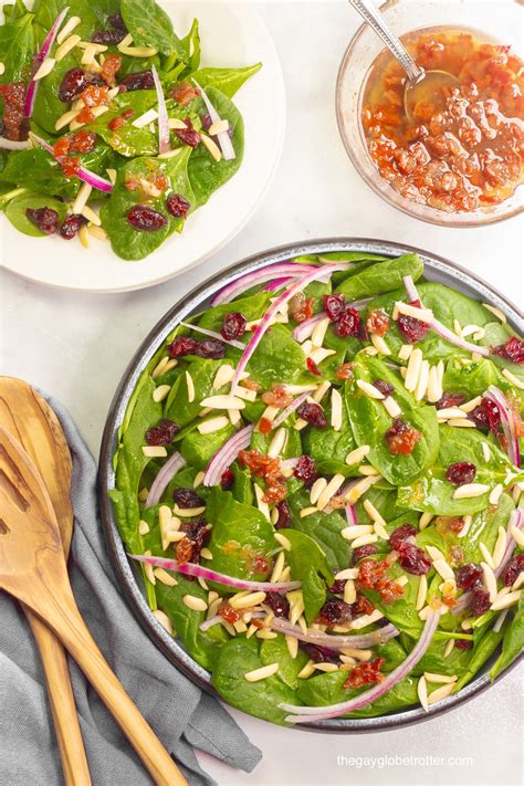 spinach-cranberry-salad-with-warm-bacon-dressing image