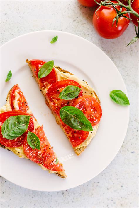 tomato-and-hummus-toast-with-fresh-basil-food-banjo image