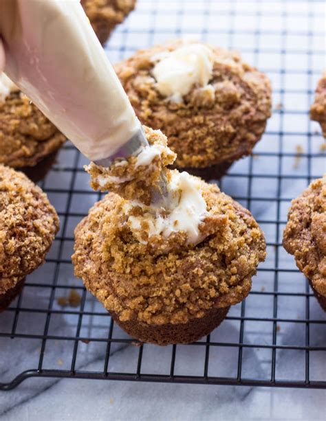 cream-cheese-frosting-filled-banana-crumb-muffins image