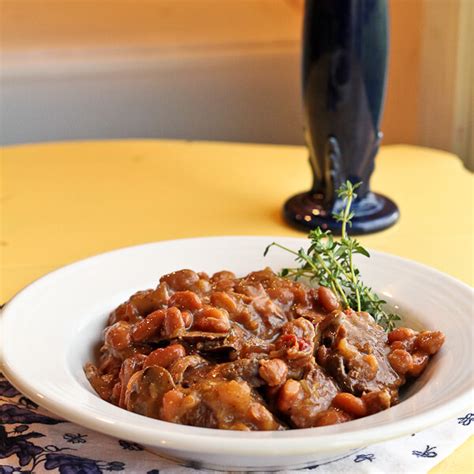 beer-braised-beef-with-thyme-mushrooms-and-beans image