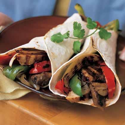 beef-chicken-fajitas-with-peppers-onions image