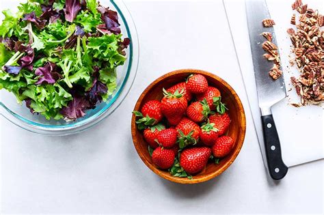 strawberry-salad-with-mixed-greens-pecans-and-feta image