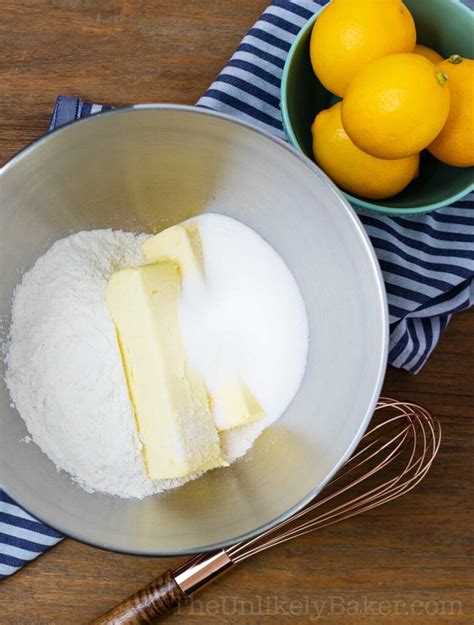 easy-meyer-lemon-bars-recipe-the-unlikely-baker image