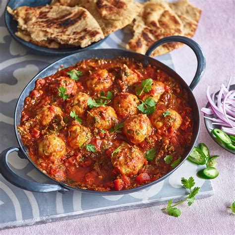 chickpea-dumplings-in-curried-tomato-sauce-eatingwell image