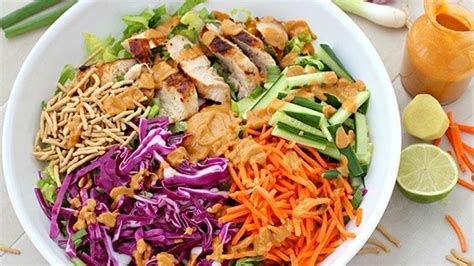 asian-grilled-chicken-salad-with-spicy-peanut-dressing image