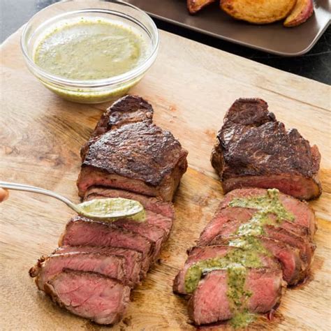 new-york-strip-steaks-with-crispy-potatoes-and-parsley image