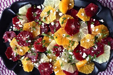 persimmon-and-arugula-salad-with-pomegranate-seeds image