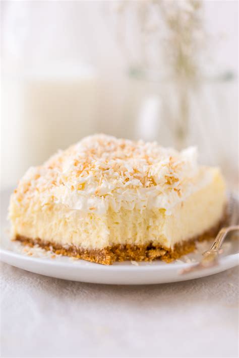 easy-coconut-cheesecake-bars-baker-by-nature image