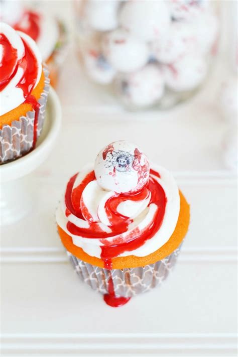 easy-halloween-bloody-eyeball-cupcakes-savvy image