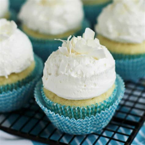 coconut-cupcakes-with-fluffy-coconut-buttercream image