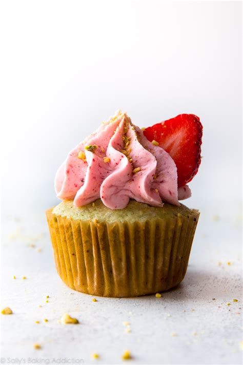pistachio-cupcakes-with-strawberry-frosting image