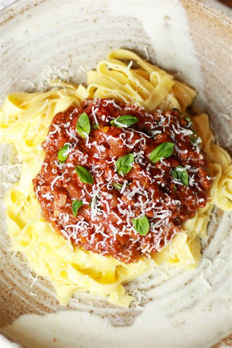 a-lusciously-rich-and-tomatoey-slow-cooker-ragu-served image