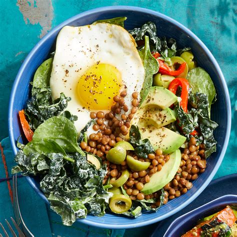 lentil-bowls-with-fried-eggs-greens-eatingwell image