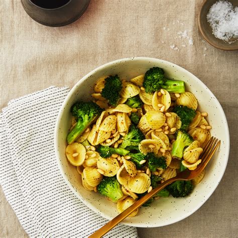 vegan-lemon-pasta-with-pine-nuts-and-broccoli image