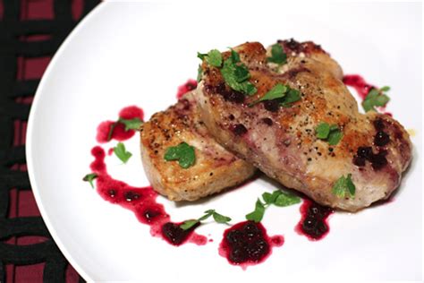 pork-chops-with-savory-blueberry-sauce-love-and-olive-oil image