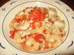sauted-shrimp-over-spaghetti-with-garlic-clam-sauce image