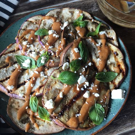 grilled-eggplant-with-harissa-tahini-sauce-dishing-out image