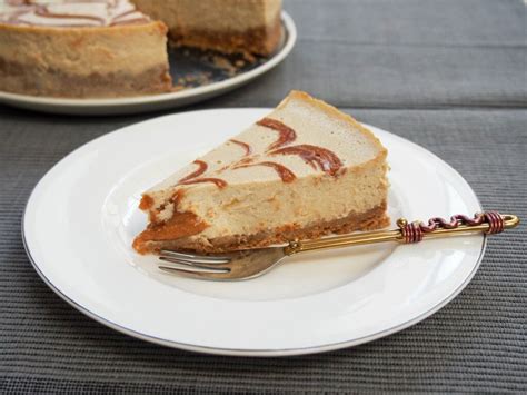 banana-baked-cheesecake-with-peanut-butter-swirls image