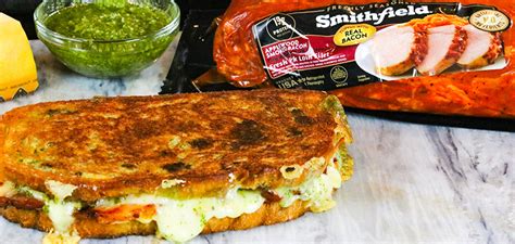 pork-swiss-panini-with-creamy-pesto-and-roasted-peppers image