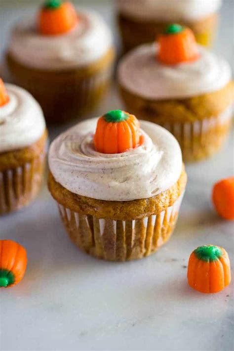 pumpkin-cupcakes-with-cinnamon-cream-cheese-frosting image