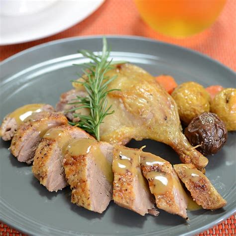 roast-duck-with-new-potatoes-and-peppercorn-sauce image