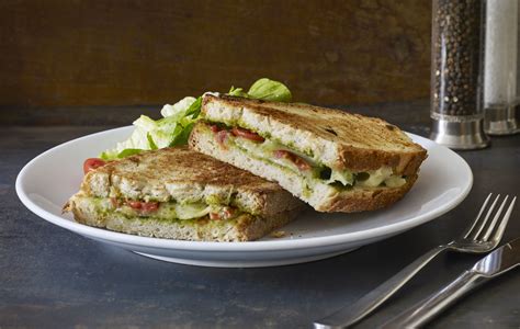 baked-grilled-cheese-pesto-sandwiches-the-spruce-eats image