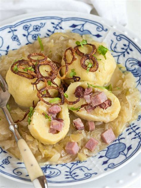 meat-stuffed-potato-dumplings-and-sauerkraut-cook image