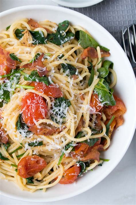 bacon-pasta-with-spinach-and-tomatoes-kay-nutrition image