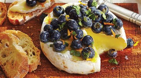 cedar-planked-brie-with-fresh-blueberry-orange-topper image