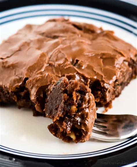 fudgy-zucchini-brownies-with-chocolate-frosting image