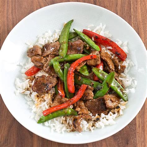 stir-fried-beef-with-snap-peas-and-red-peppers image