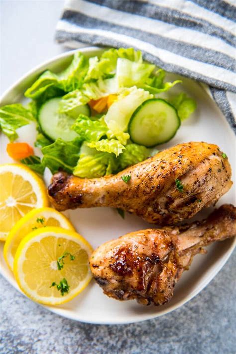 lemon-herb-grilled-chicken-drumsticks-garnished-plate image