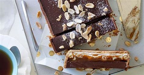 nougat-salted-peanut-caramel-and-milk-chocolate-tart image
