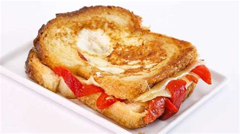 sunny-andersons-grilled-cheese-egg-in-the-hole image