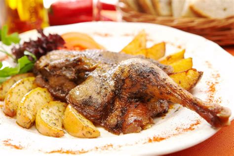 polish-roast-duck-with-apples-recipe-the-spruce-eats image