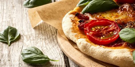 grilled-margherita-pizza-recipe-traeger-grills image