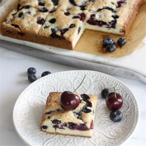 fresh-blueberry-and-cherry-cake-bars-sip-bite-go image