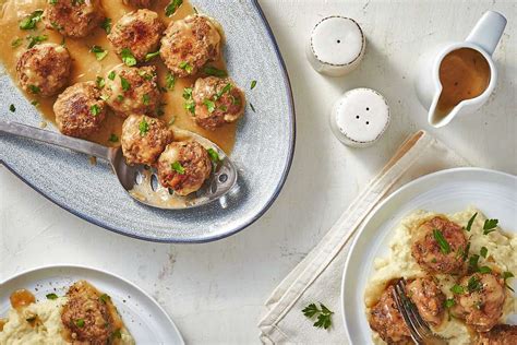 family-meatballs-with-brown-gravy-recipe-the-spruce image