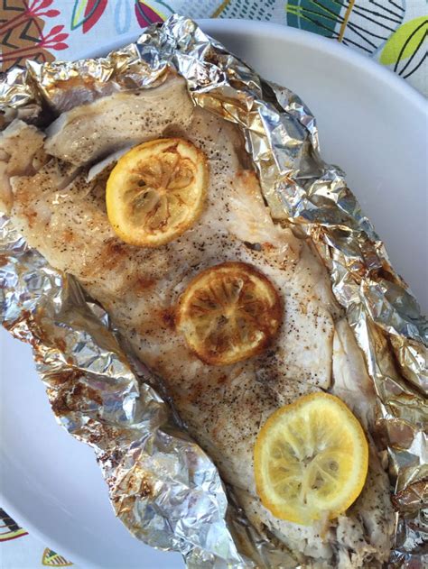 fish-in-foil-packets-recipe-with-lemon-butter image