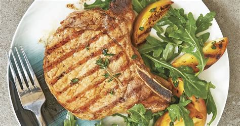 maple-brined-pork-chops-with-grilled-peaches image