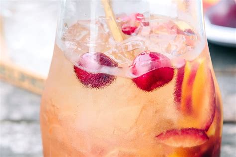 white-sangria-with-peaches-plums-cocktail image