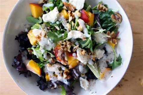 mixed-greens-salad-with-peaches-goat-cheese-and image