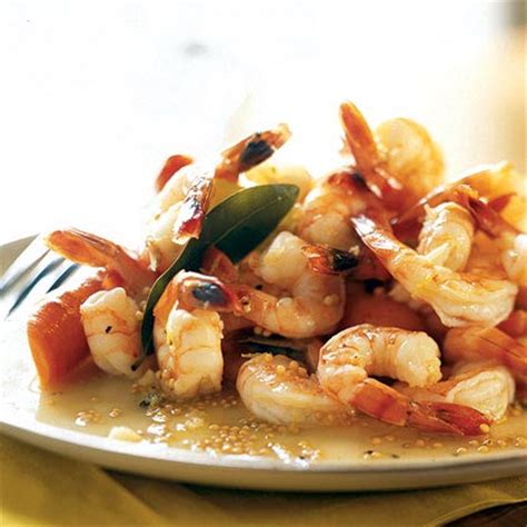 poached-shrimp-with-bay-leaves-and-lemon image