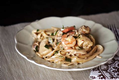 cajun-chicken-shrimp-and-sausage-alfredo-pasta image