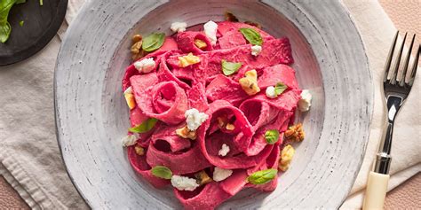 beet-pasta-with-goat-cheese-walnuts-eatingwell image