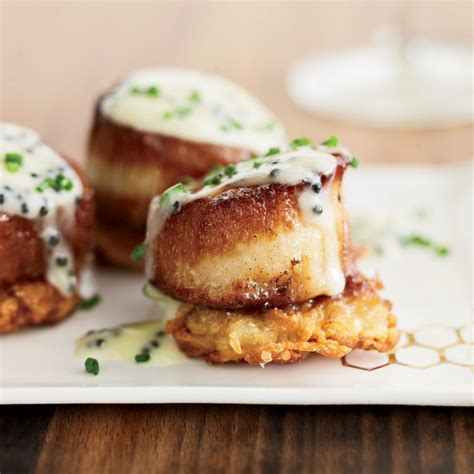 scallops-with-potato-pancakes-and-caviar-sauce-food image