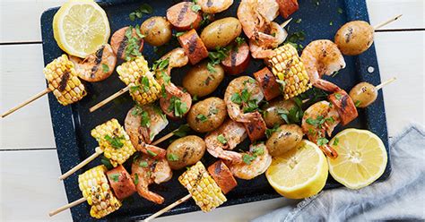 shrimp-boil-skewers-with-corn-recipe-purewow image