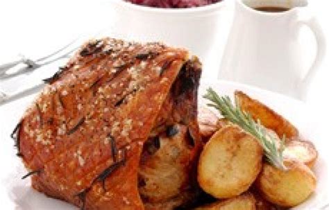 roast-loin-of-pork-with-herbs-and-spiced-apricots image