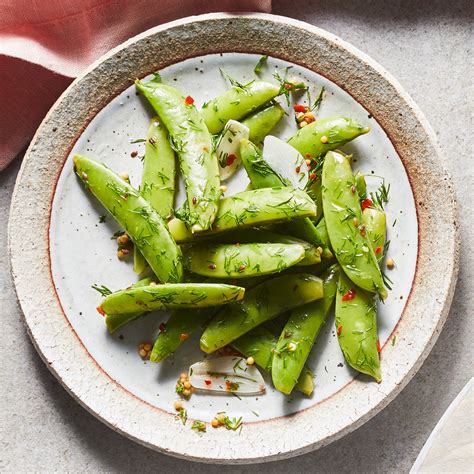 dilly-pickled-snap-peas-recipe-eatingwell image