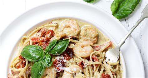 creamy-pasta-with-shrimp-pesto-and-tomatoes image
